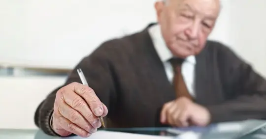 old person signing a will