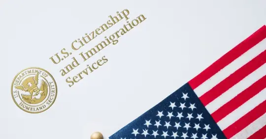 US flag and immigration document