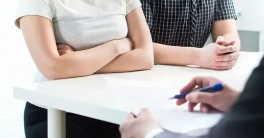 divorced parents talking to lawyer about child custody